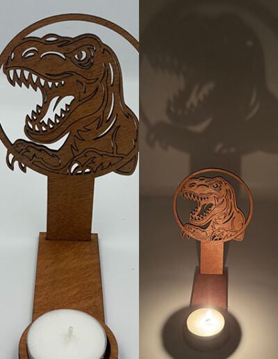 Wooden T-Rex tealight holder casting a dramatic dinosaur shadow on the wall, handmade decorative candle holder. 🦖🕯️